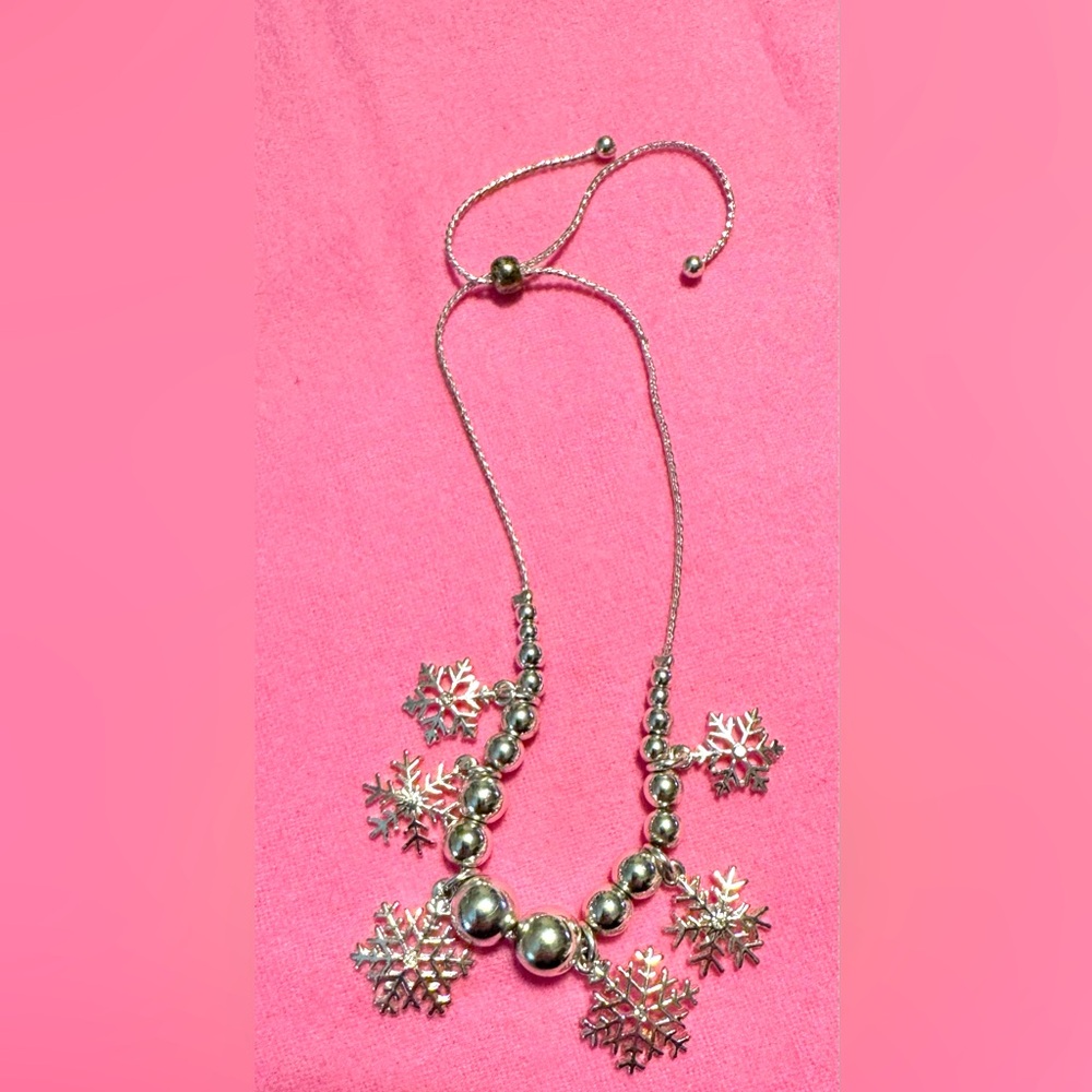 Silver tone snowflake and bead adjustable bracelet